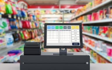 Cash register and isles of goods.