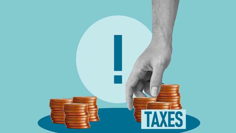 Tax increase concept with hand taking coins from stack labeled taxes, higher taxes and rising financial burden, government policy impact on personal income, budget pressure and economic challenge idea